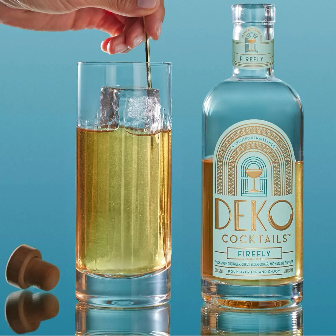 Firefly cocktail bottle with a golden drink being stirred in a tall glass, perfect for online orders.