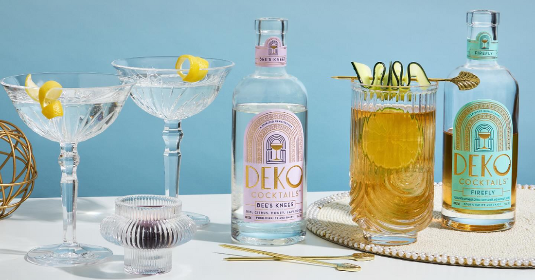 Premixed cocktails from Deko displayed with elegant glassware and citrus garnishes on a stylish surface.